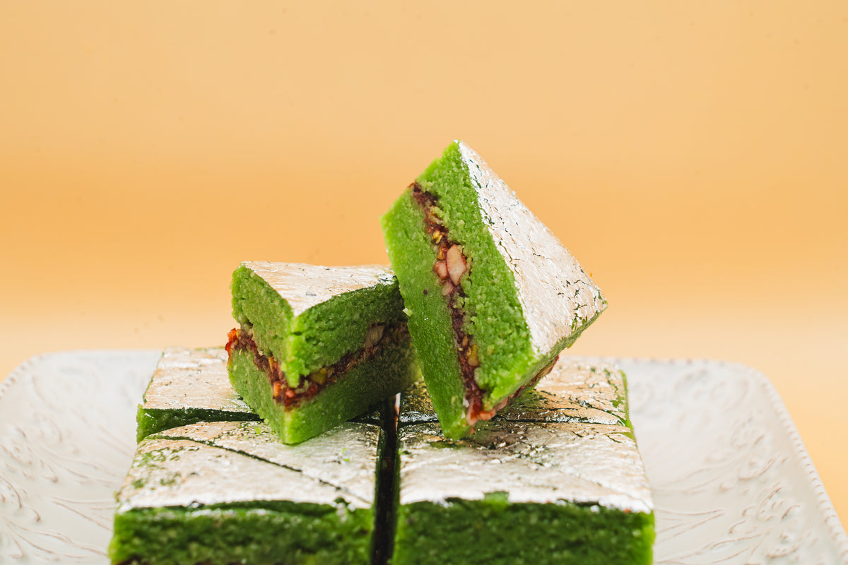 Close-up of handcrafted Kaju Gulkand showing the rich, sweet rose petal center surrounded by smooth cashew fudge.