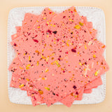 squares of authentic Rose Bombay Ice Halwa garnished with premium nuts, an artisanal Indian mithai by Pavitre.