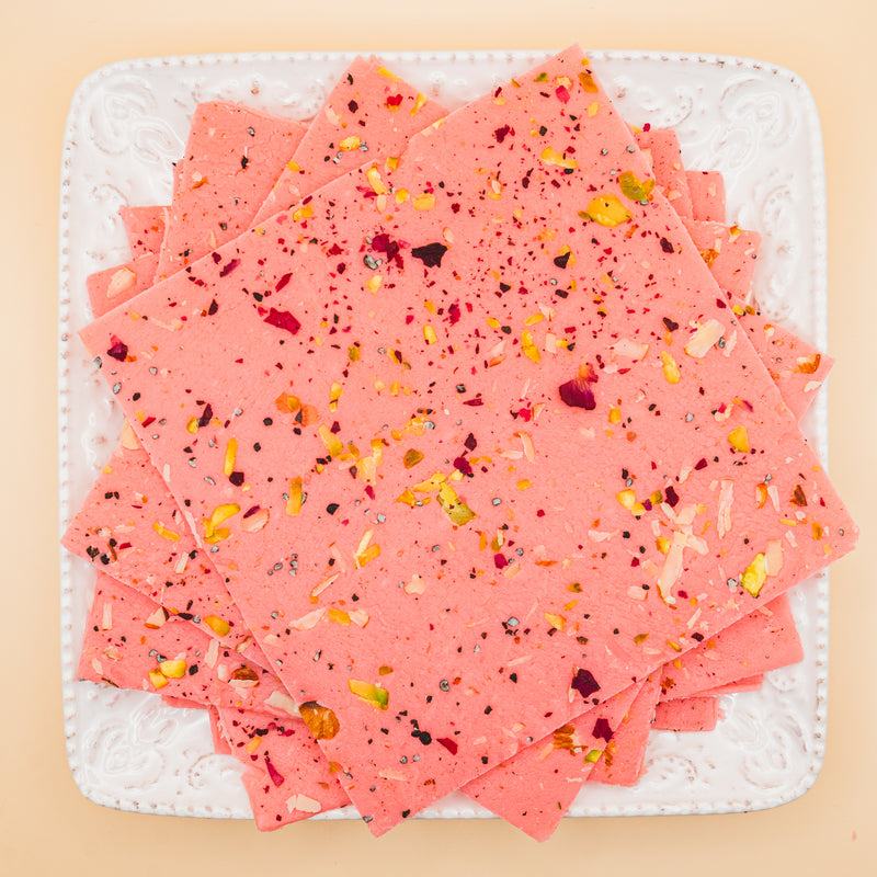 squares of authentic Rose Bombay Ice Halwa garnished with premium nuts, an artisanal Indian mithai by Pavitre.