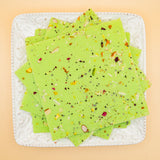 squares of authentic Pistachio Bombay Ice Halwa garnished with premium nuts, an artisanal Indian mithai by Pavitre.