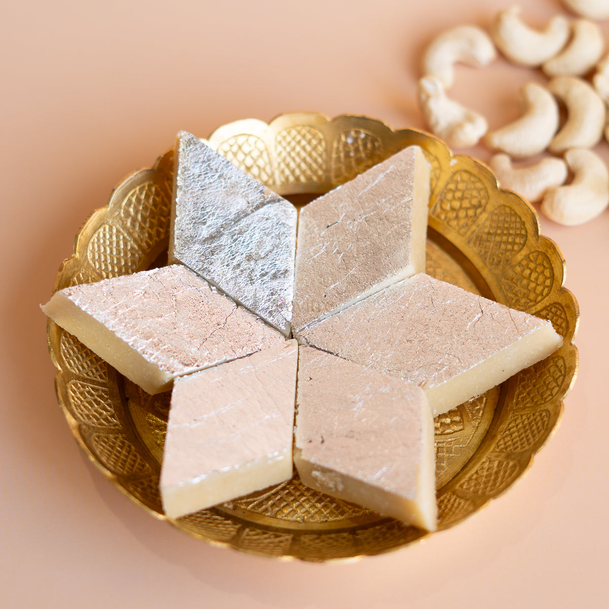 Diamond-shaped Kaju Katli sweets made from premium cashews, a pure vegetarian treat with no artificial preservatives.