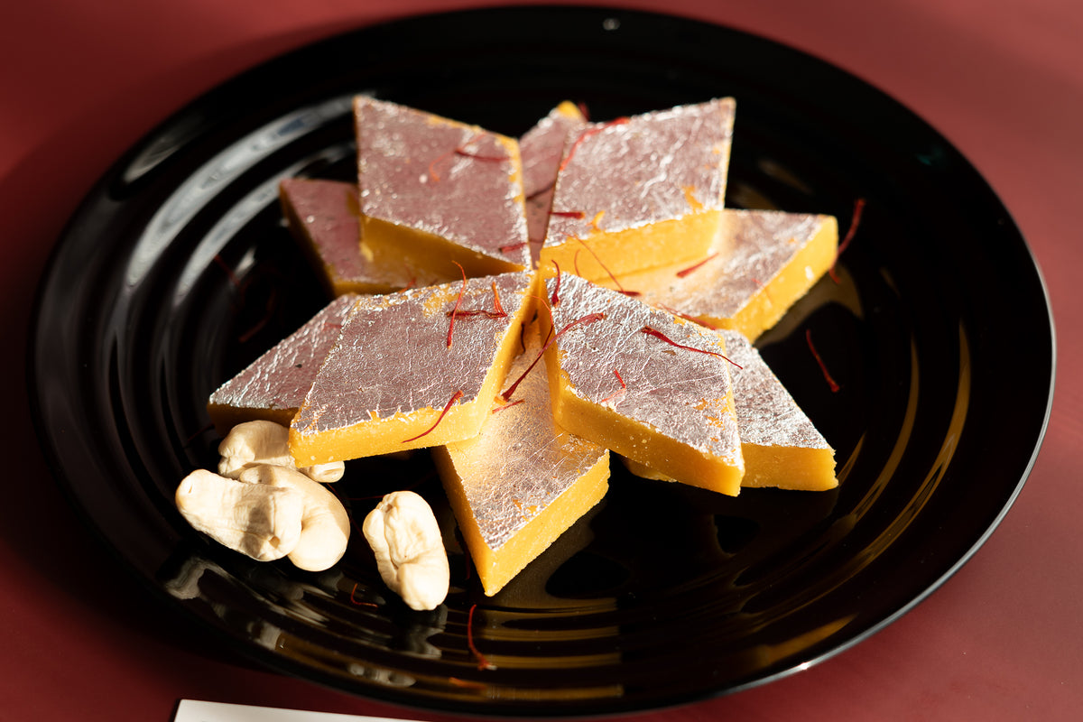 Hand-made Saffron Cashew Katli sweets, freshly prepared with high-quality ingredients and strict vegetarian standards in Melbourne.