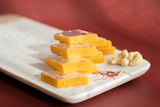 Kesar Kaju Katli sweets made from premium cashews, a pure vegetarian treat with no artificial preservatives.