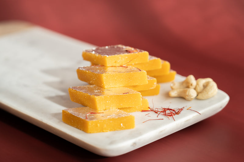 Kesar Kaju Katli sweets made from premium cashews, a pure vegetarian treat with no artificial preservatives.