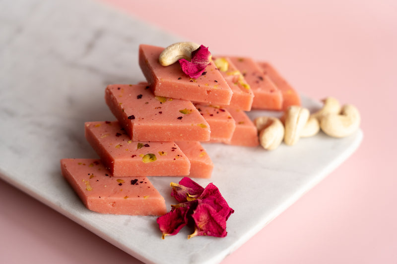 Handcrafted Rose Kaju Katli, a premium vegetarian Indian sweet infused with rose flavor, made by Pavitre in Tarneit, VIC.