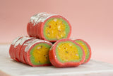 liced Kaju Casatta rolls showing layers of premium cashew and pistachio filling, a pure vegetarian mithai.